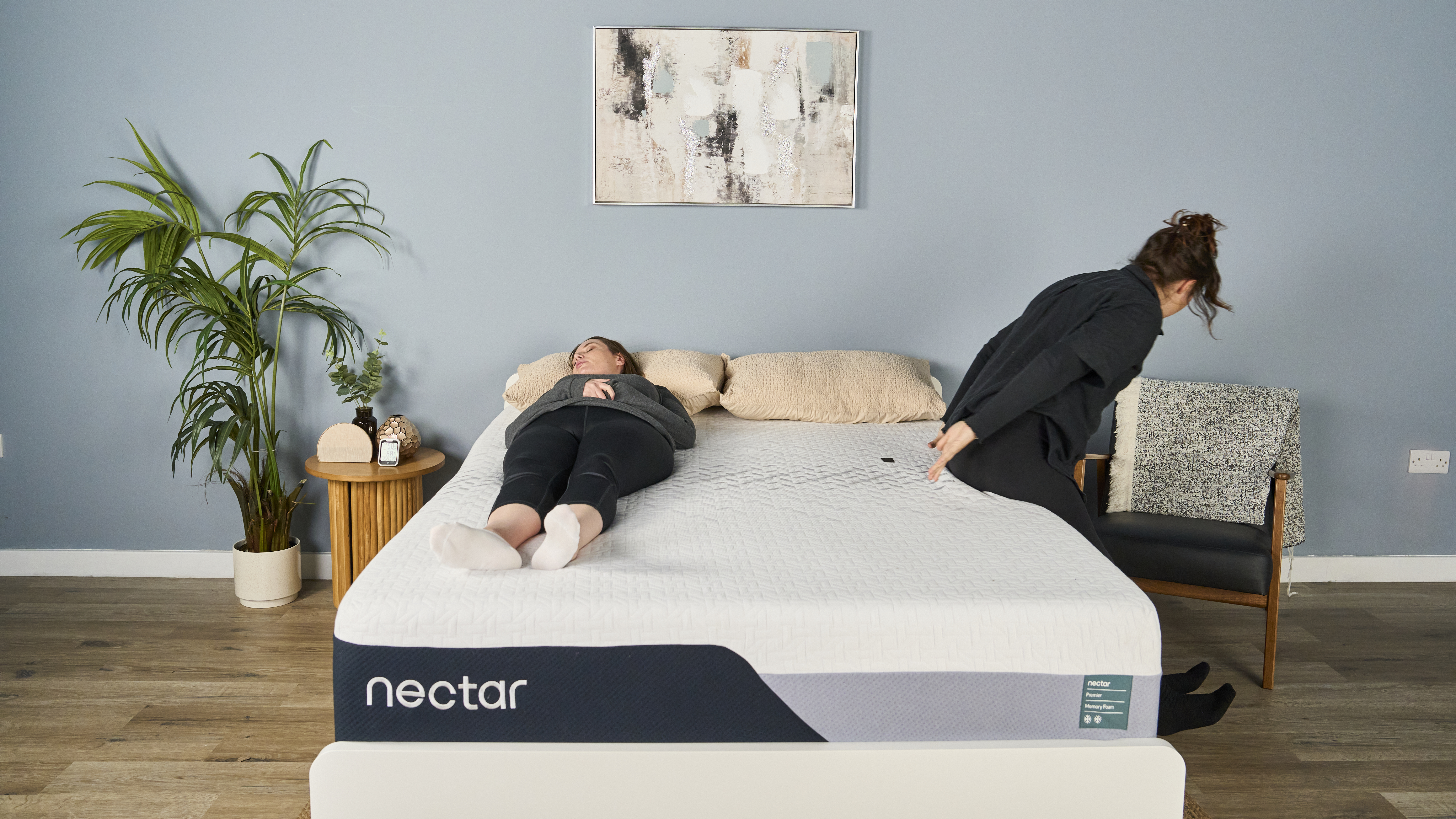 Tester Ruth Jones lies still on the Nectar Premier Memory Foam while sleep editor Lauren Jeffries gets off it.