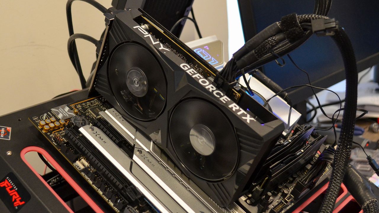 A PNY GeForce RTX 4060 Verto on a table with its retail box