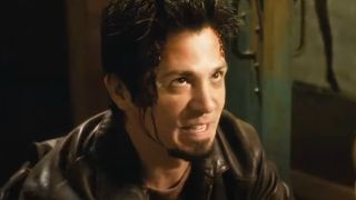 Freddy Rodriguez looking up with a wild smile in Grindhouse.