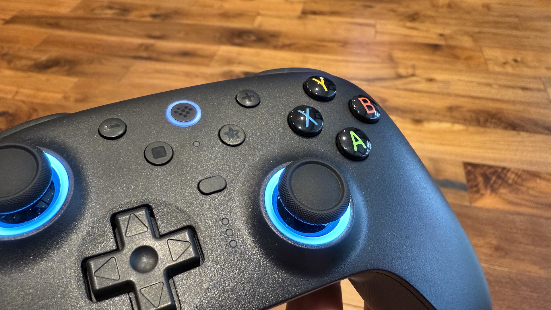 The 8BitDo Ultimate 2 controller, with dock and USB connection at home