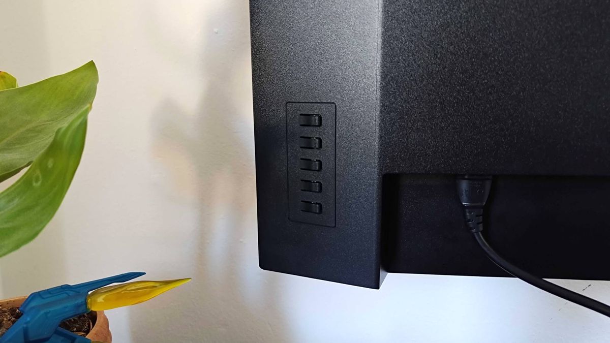 Close up of Lenovo Legion R27qe monitor buttons at back.