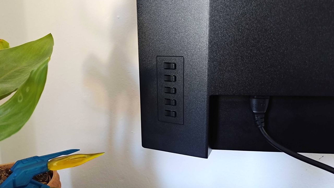 Close up of Lenovo Legion R27qe monitor buttons at back.