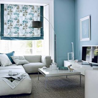 living room with sky blue wall and floor lamp
