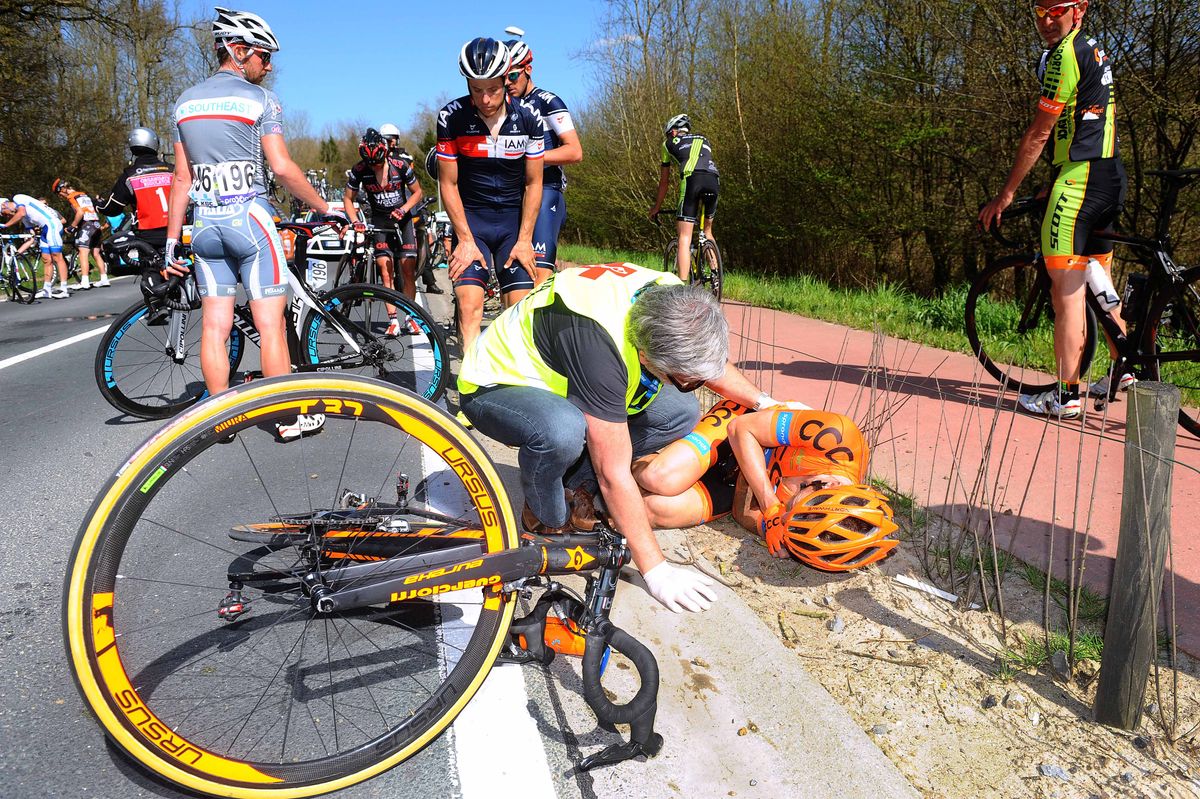 Grega Bole (CCC Sprandi) gets medical attention