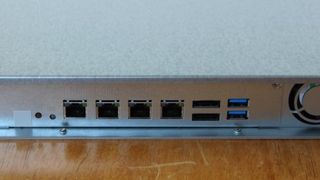 There are four gigabit Ethernet ports at the rear, but no 10GbE support