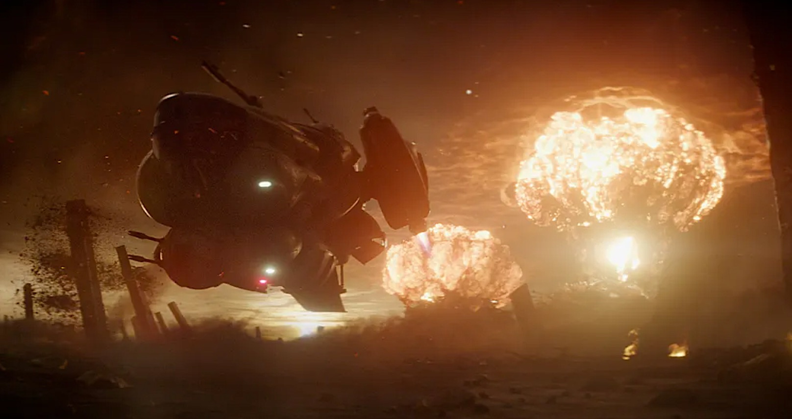 a spaceship zooms past as explosions burst in the distance