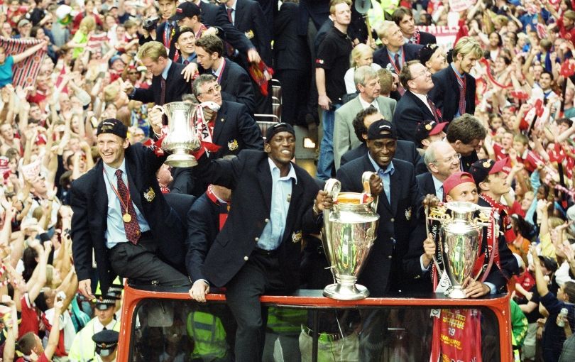 Manchester United players celebrate the treble on an open-top bus