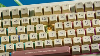 A beige, brown and off-white Epomaker RT100 wireless mechanical keyboard