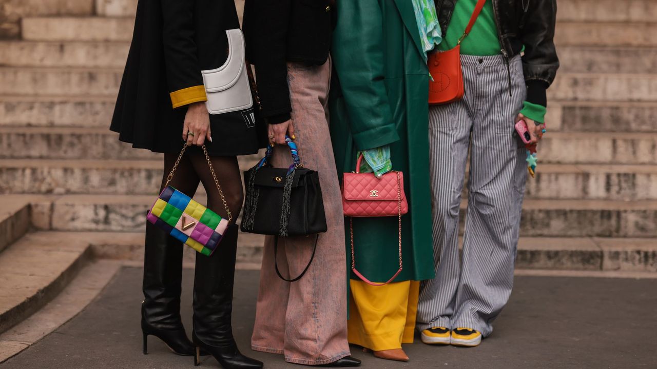 A group of women holding investment handbags