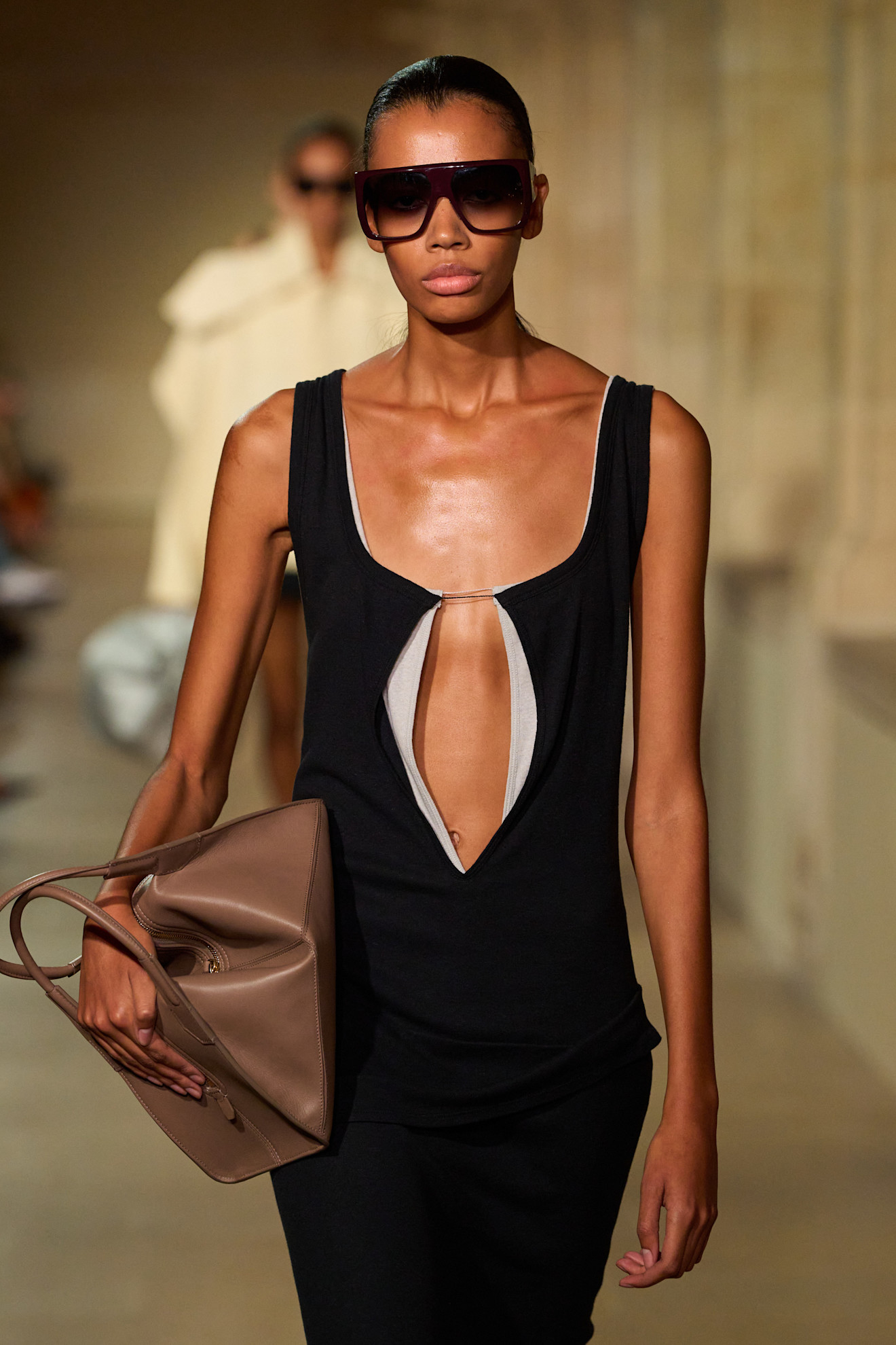 A model wearing Victoria Beckham oversized sunglasses.