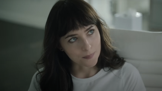 Dakota Johnson looking to the side in white T-shirt in Am I Ok? 