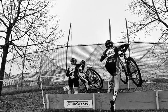 The riders hop the hurdles on the way up.