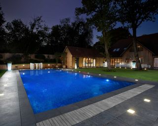 pool with decking lights by Mermaid Pools