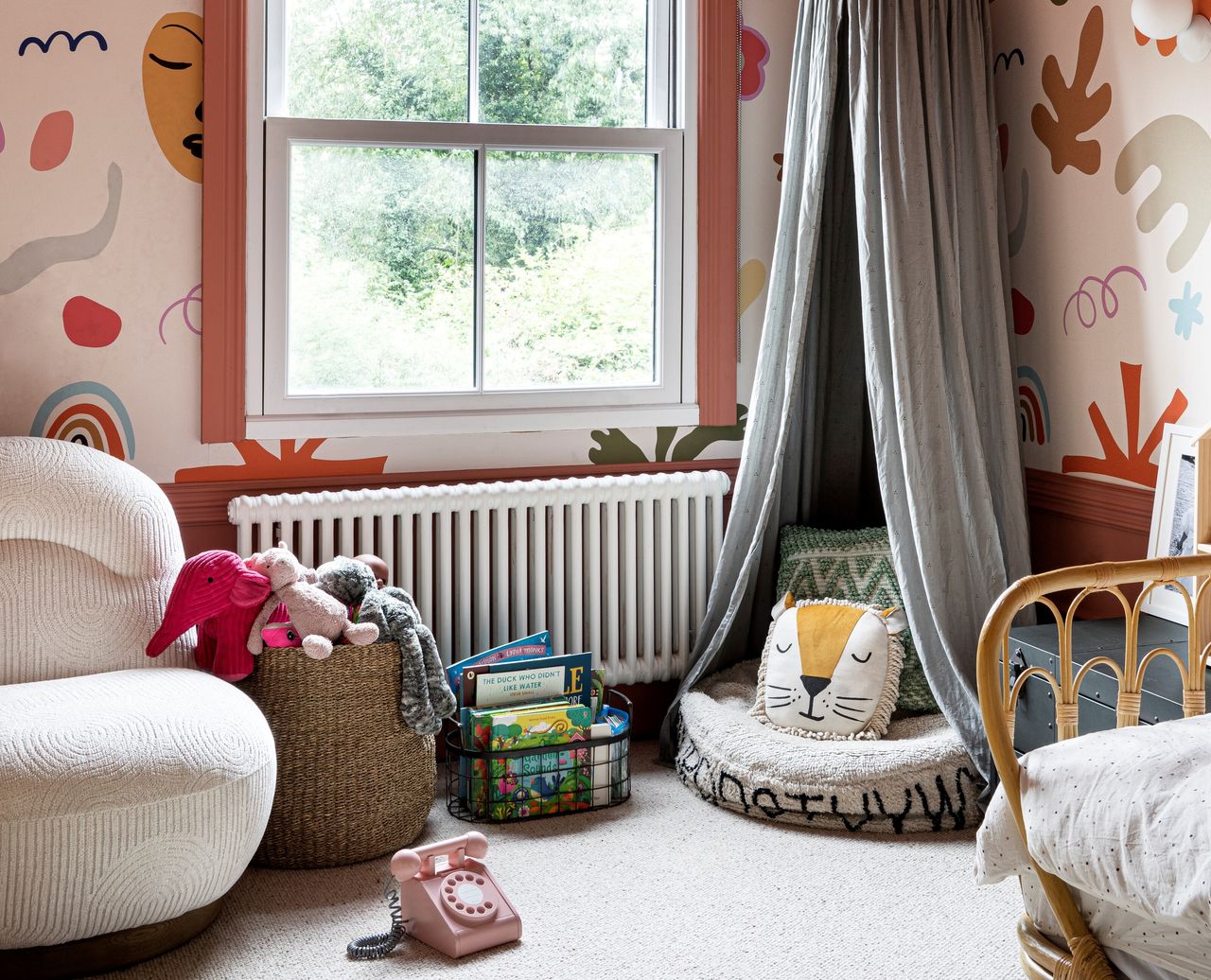 A kid&#039;s bedroom with a playful wallpaper design