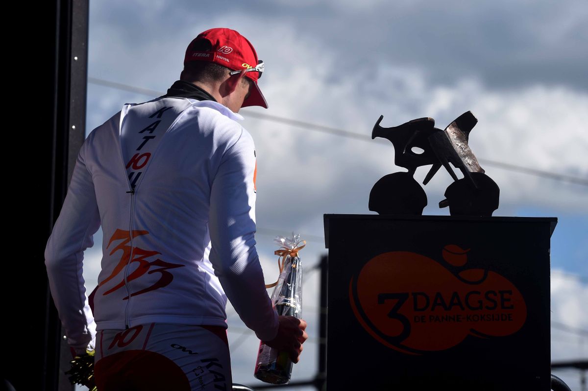 Race leader Alexander Kristoff (Katusha) passes the trophy