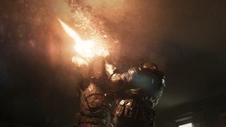 Marcus firing a gun at a Locust Drone during the Gears of War: E-Day trailer.