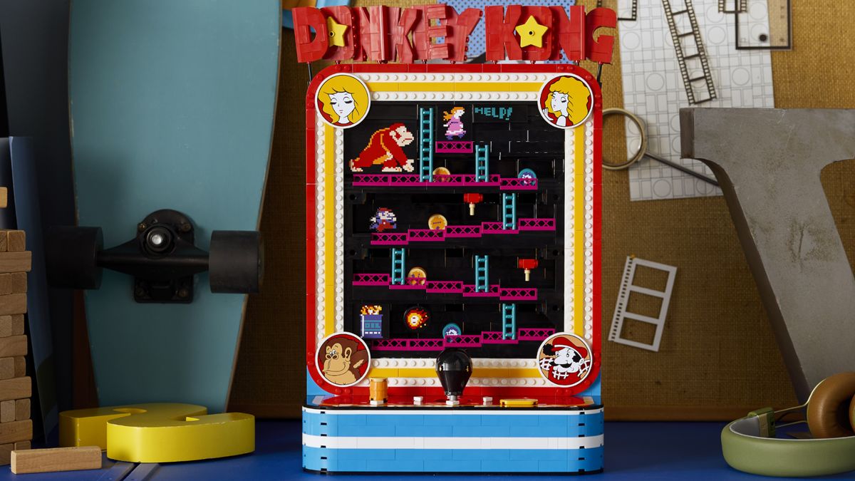 Lego Donkey Kong Arcade set on a backdrop filled with skateboards, giant letters, and a corkboard