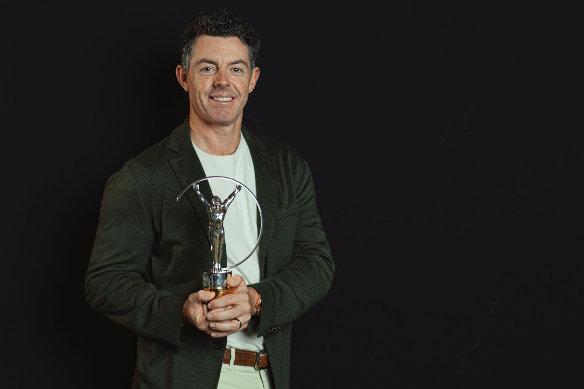 Rory McIlroy poses with his Laureus World Sports Award after his 2025 Masters win was named Comeback of the Year