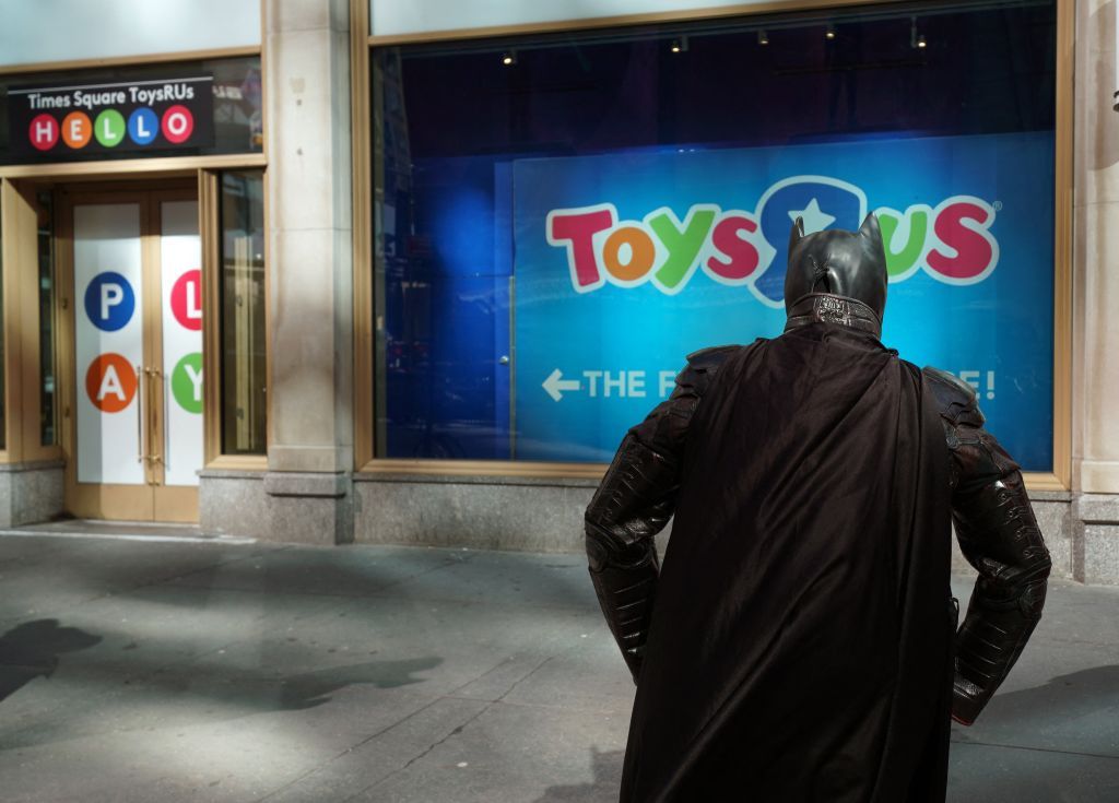 A Batman mascot waits to be interviewed by media at the Toys R Us in Times Square March 15, 2018 in New York.