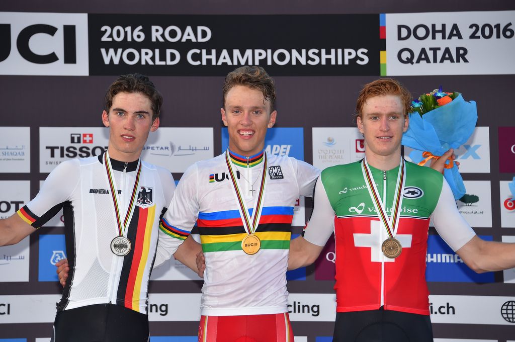 The smiling junior men's podium