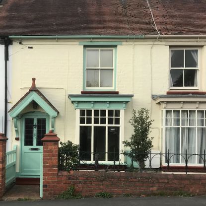 Teal and yellow exterior of Victorian mid-terrace