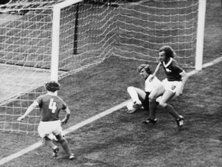 East German player Konrad Weise (left) prevents a goal against West Germany in the teams' group match in Hamburg in the 1974 World Cup.
