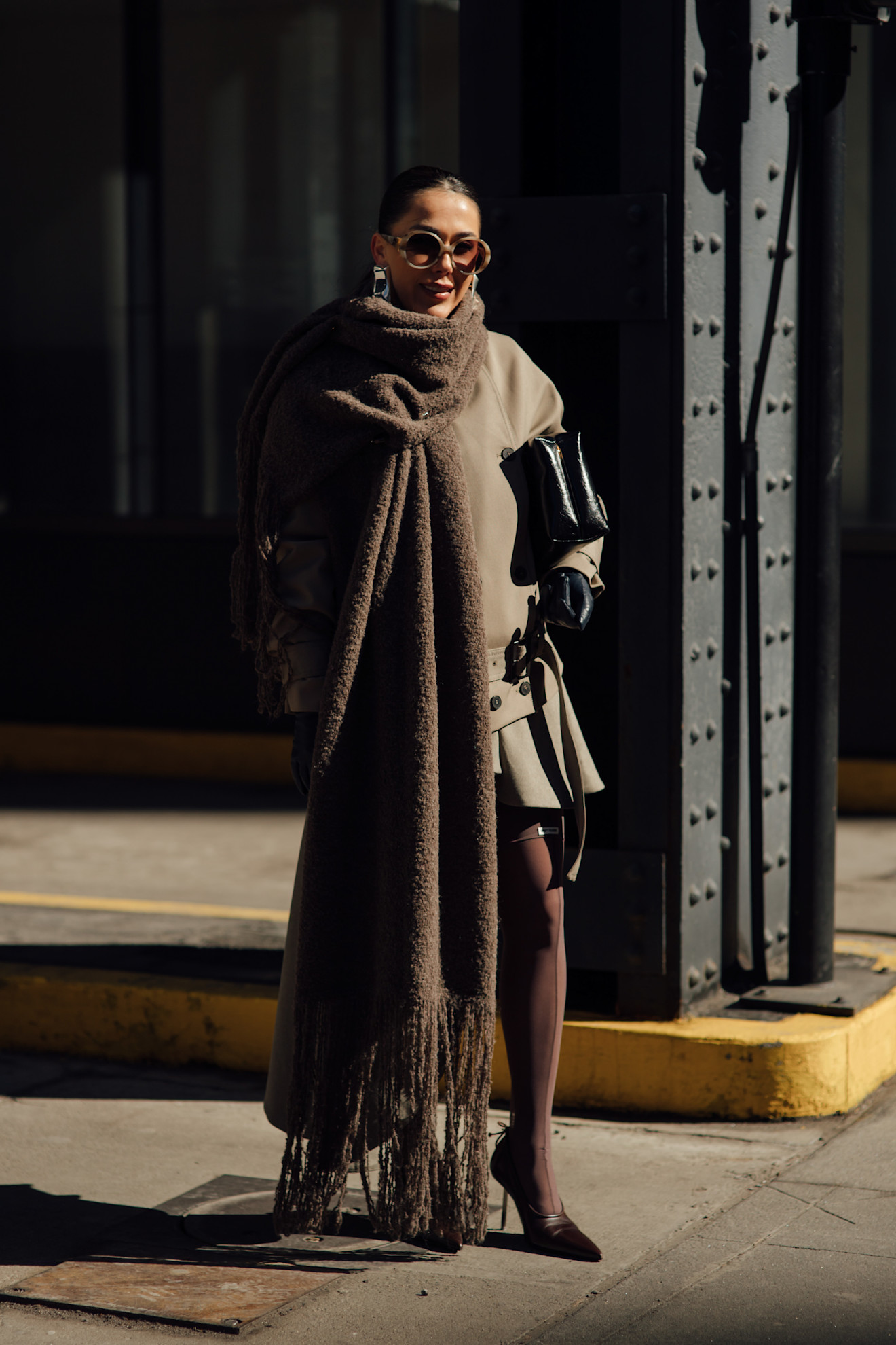 woman wearing scarf, skirt, jacket, heels, and tights
