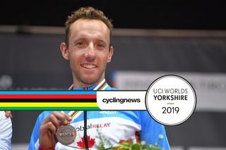 Canada's Michael Woods sports his bronze medal at the 2018 Worlds road race in Innsbruck. Will the less hilly course at the 2019 race in Yorkshire not prove tough enough for him to figure among the medals again?