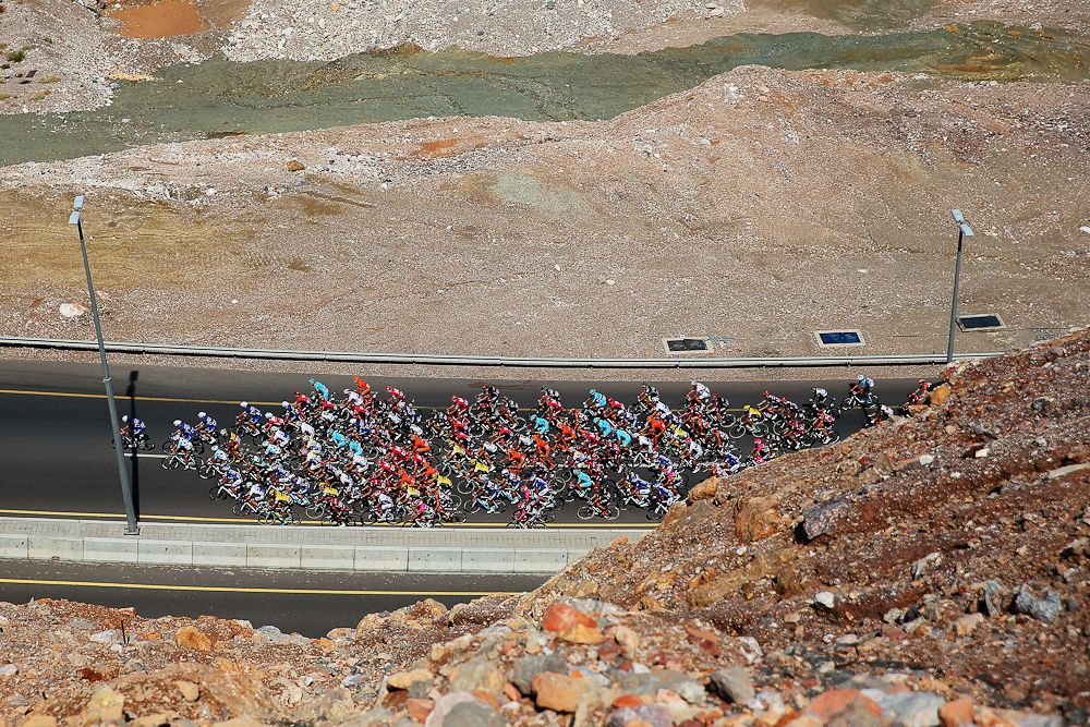 The peloton rides through the Oman countryside during stage two of the 2016 Tour of Oman
