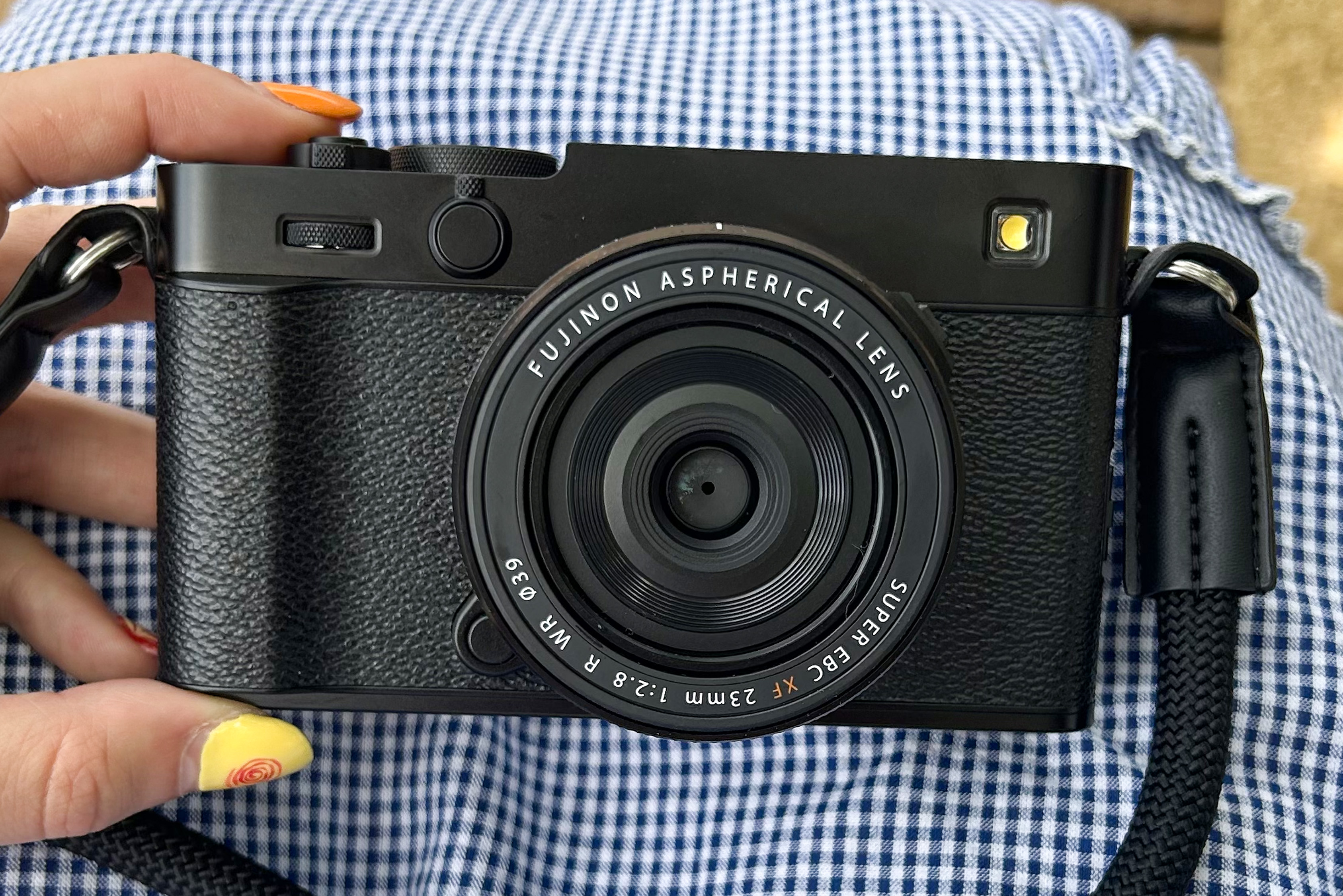 Hand holding the new Fujifilm X-E5 film simulation camera.
