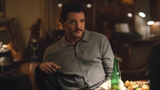 Pedro Pascal sits at a table in conversation in the trailer for Behemoth!