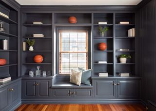 bookshelves and cabinetry in navy painted wood
