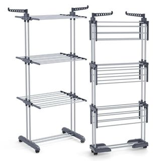 A stainless steel clothes drying rack is shown both open and folded up (side by side). white background