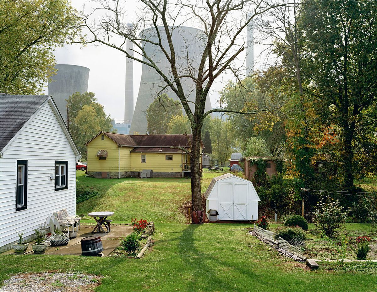 Houses next to power plant.