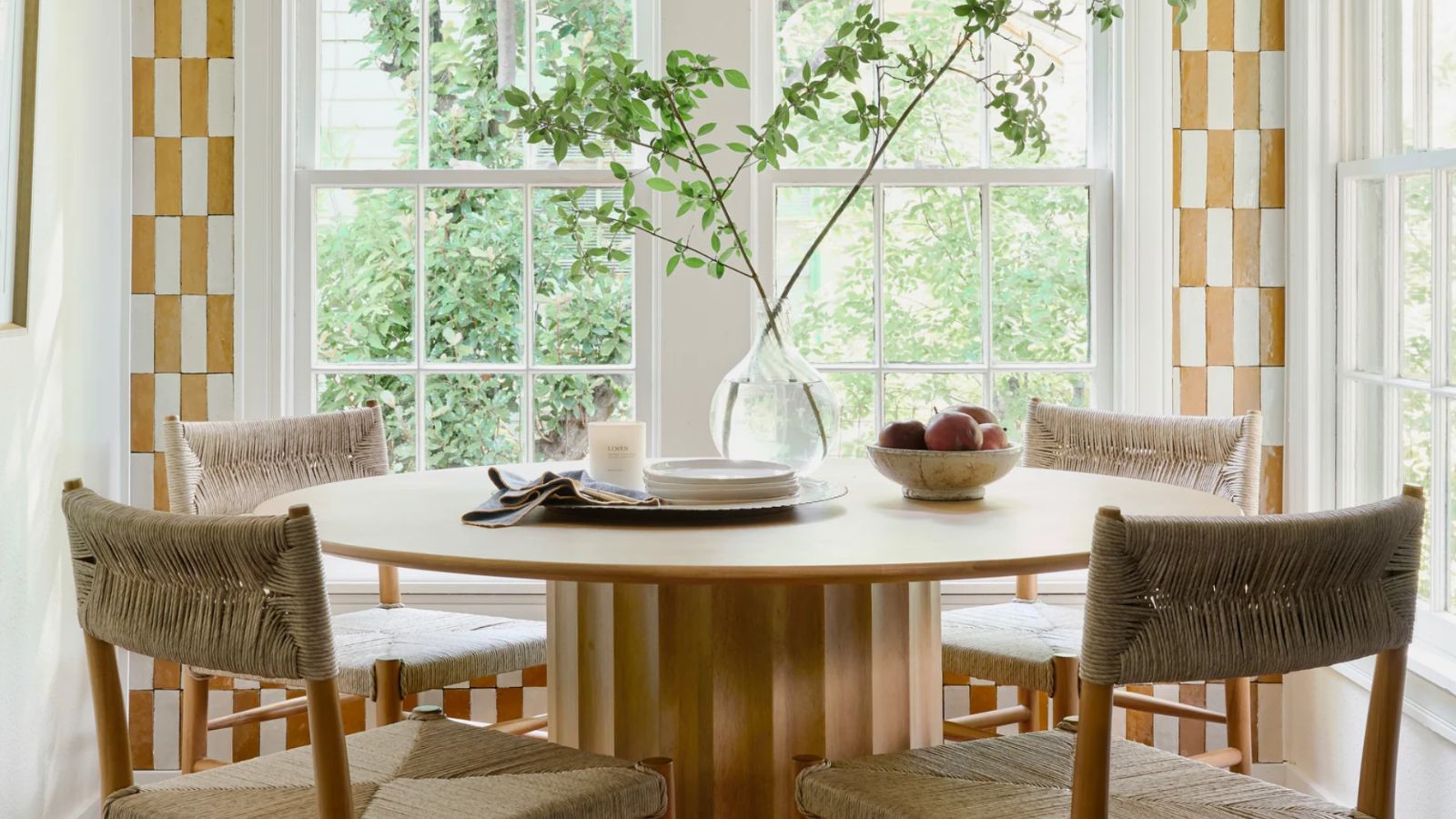Magnolia Mini Reni 2.0 Breakfast nook, featuring a Cream Accent Bowl filled with fruit on a wood table