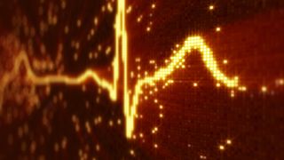 Image of a heart monitor trace on a digital background