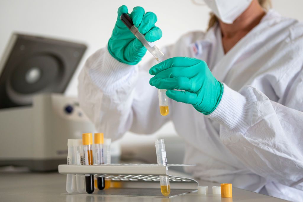 Medical worker Beatrice Schlaegel works with blood sample from local residents in a mobile laboratory during a study to analyse the presence of Covid-19 antibodies on May 20, 2020 in Kupferze