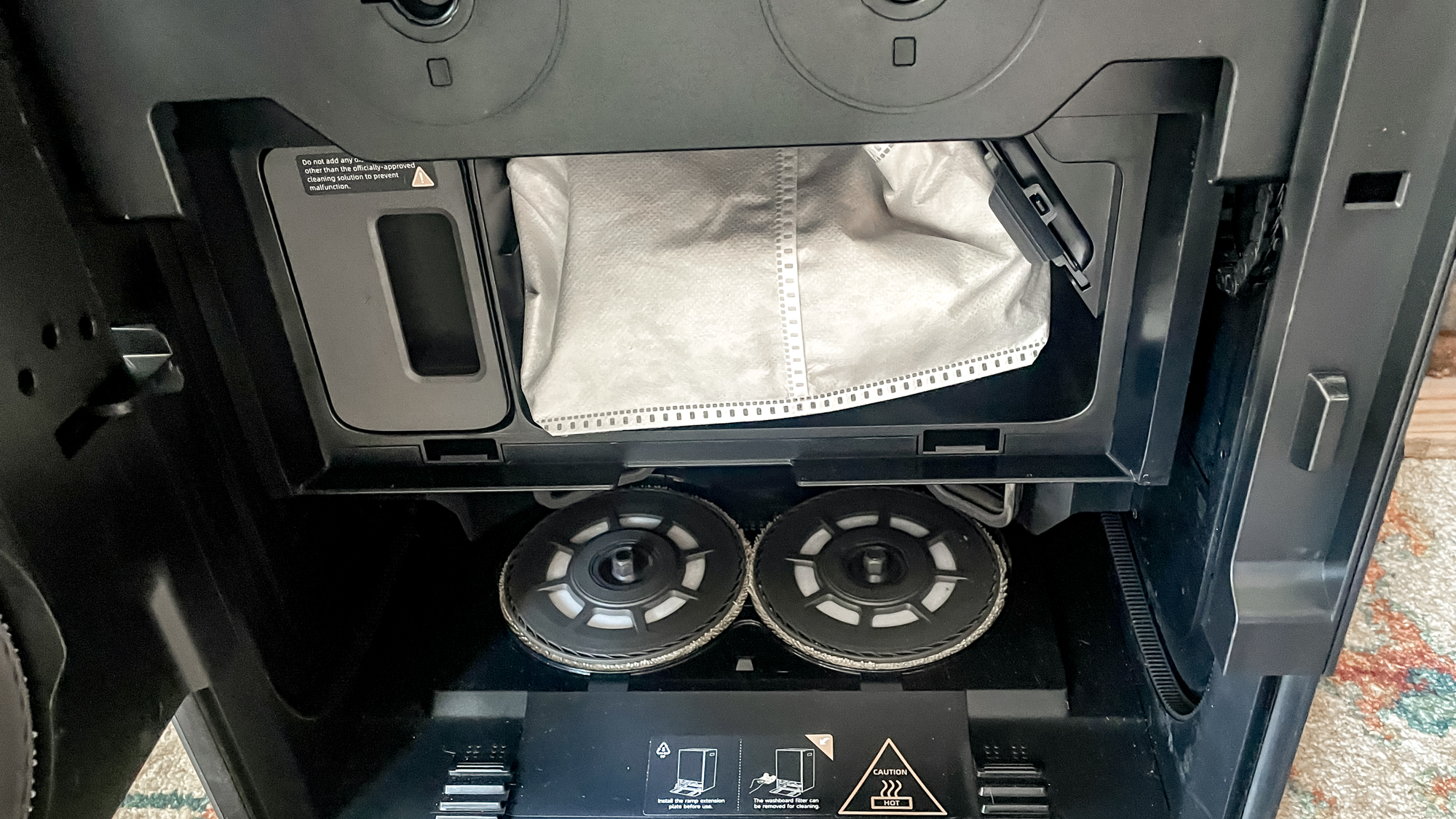 Inside of the Mova Mobius 60 robot vacuum base station