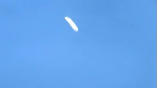 a video screengrab showing two lights in the sky of a UFO