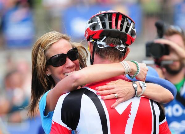 Meg Wells congratulates her husband Todd at the finish after his win.