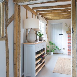 farmhouse with modern extension decorated in shades of grey and white