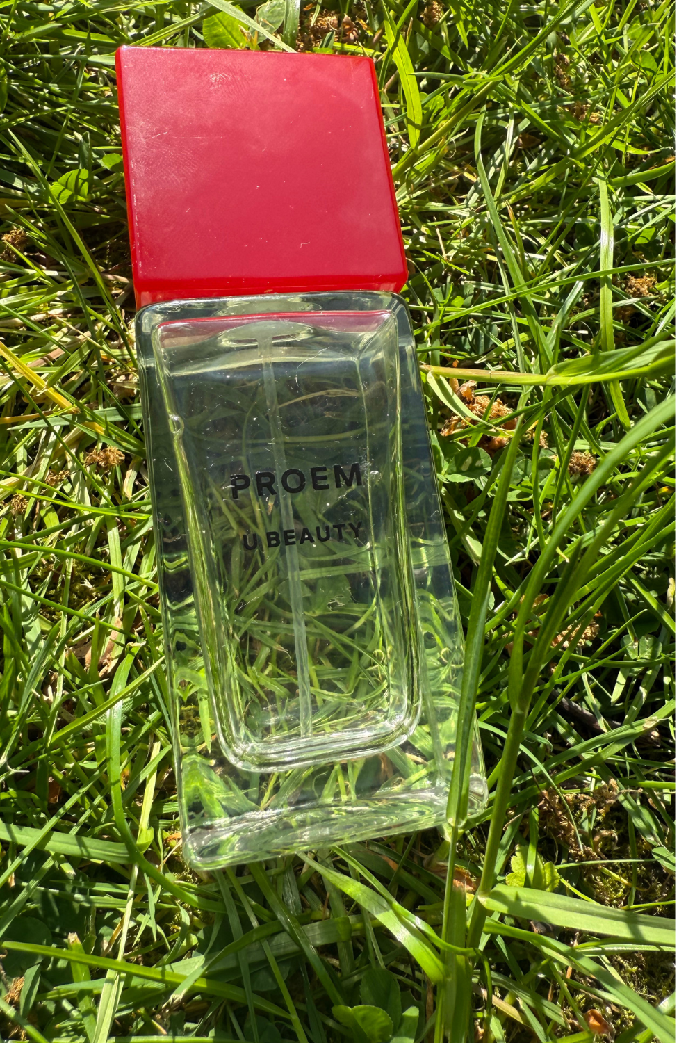 Proem by U beauty bottle in the grass