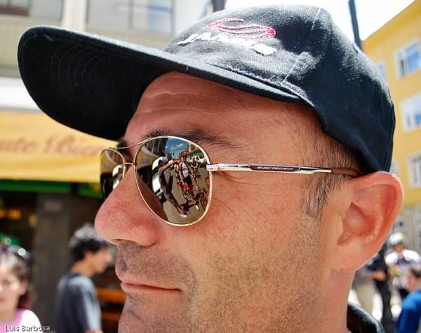 A Jamis-Sutter Home rider reflected on a sunglass lens.