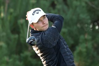 Nicolai Hojgaard hits a fairway wood off the tee