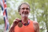 Sir Jim Ratcliffe poses with his medal after completing the 2024 London Marathon 
