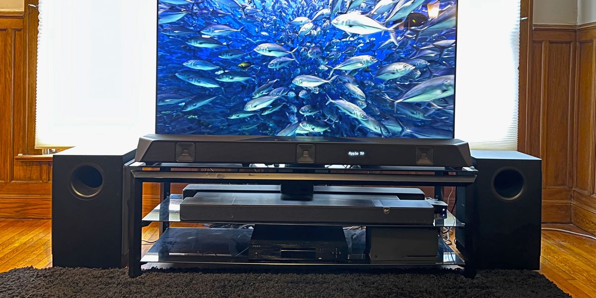 Nakamichi Dragon soundbar system in living room with undersea image of fish on screen