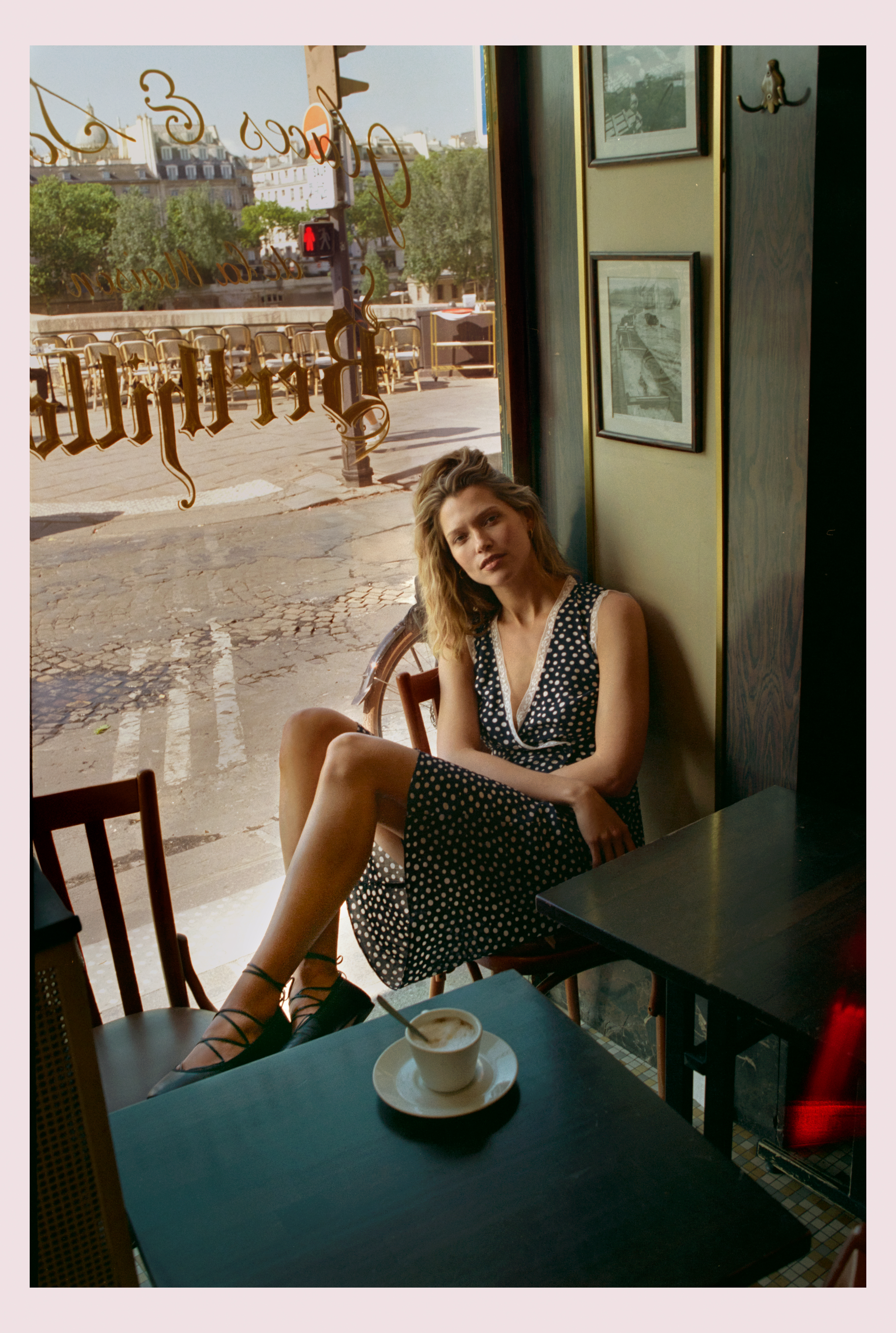 a model wearing the jcrew x rouje collaboration polka dot dress