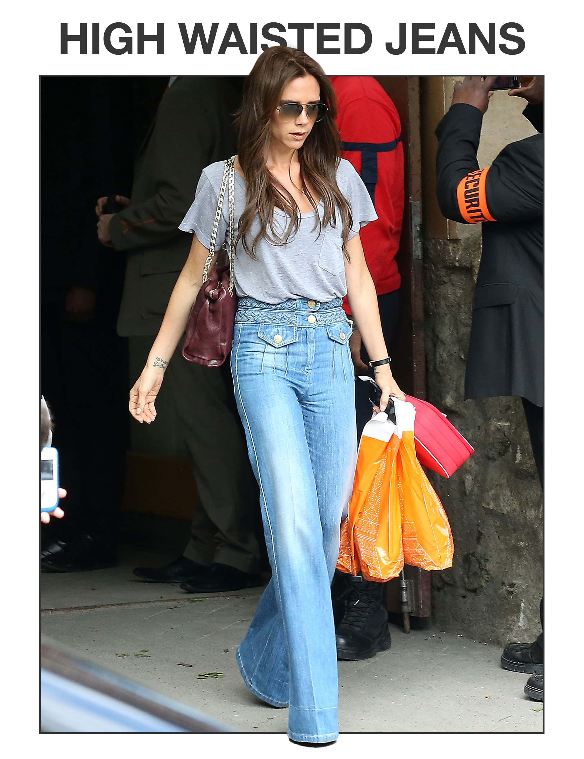 Victoria Beckham wearing High-Waisted Jeans.