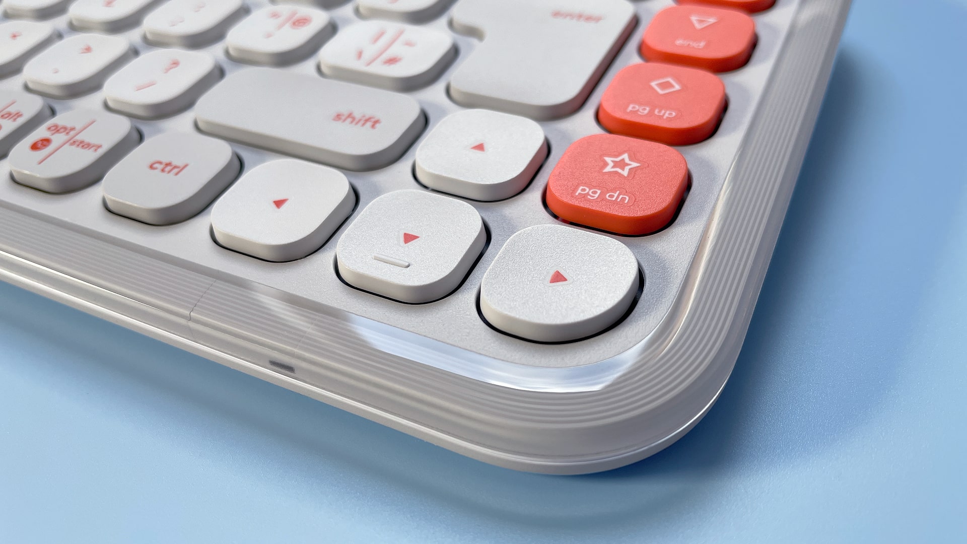 The Logitech POP Icon Keys keyboard against a blue background.