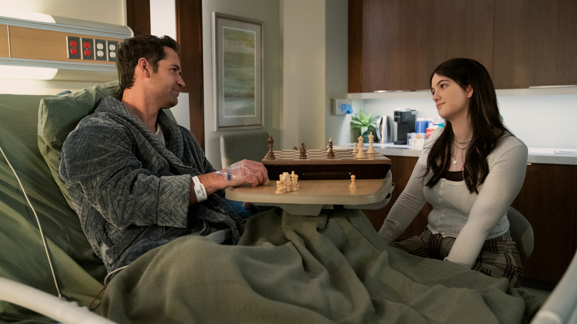 Hayley visits Mickey in his hospital bed in The Lincoln Lawyer season 2